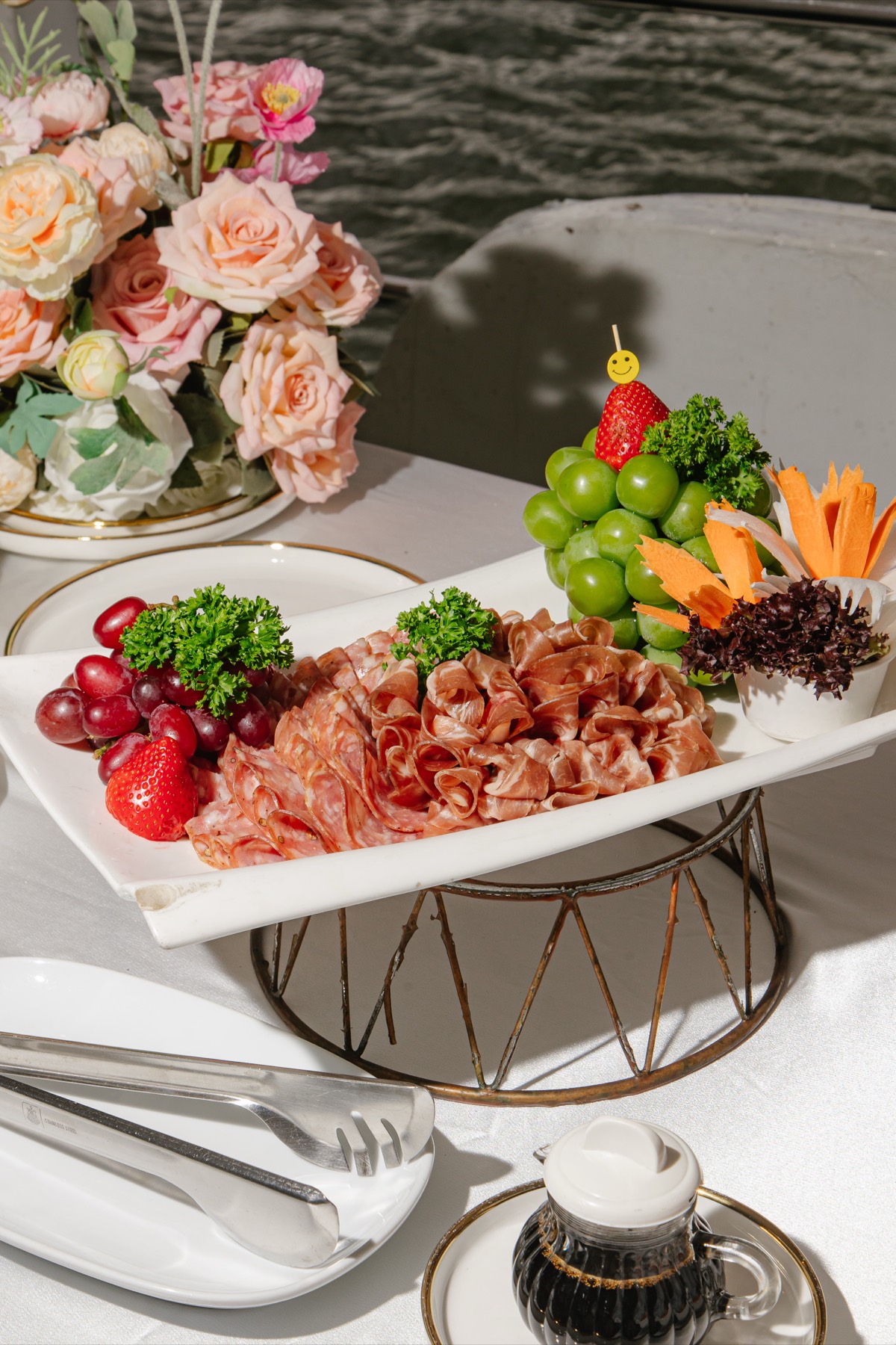 Carved fruit and a charcuterie board